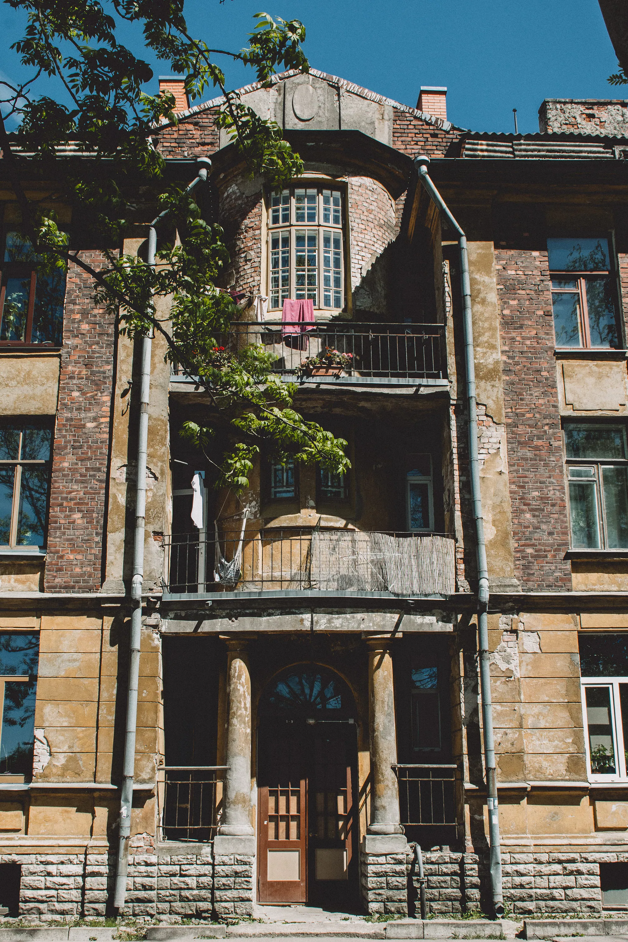 Weathered residential balconies and brickwork in Kopli, Tallinn
