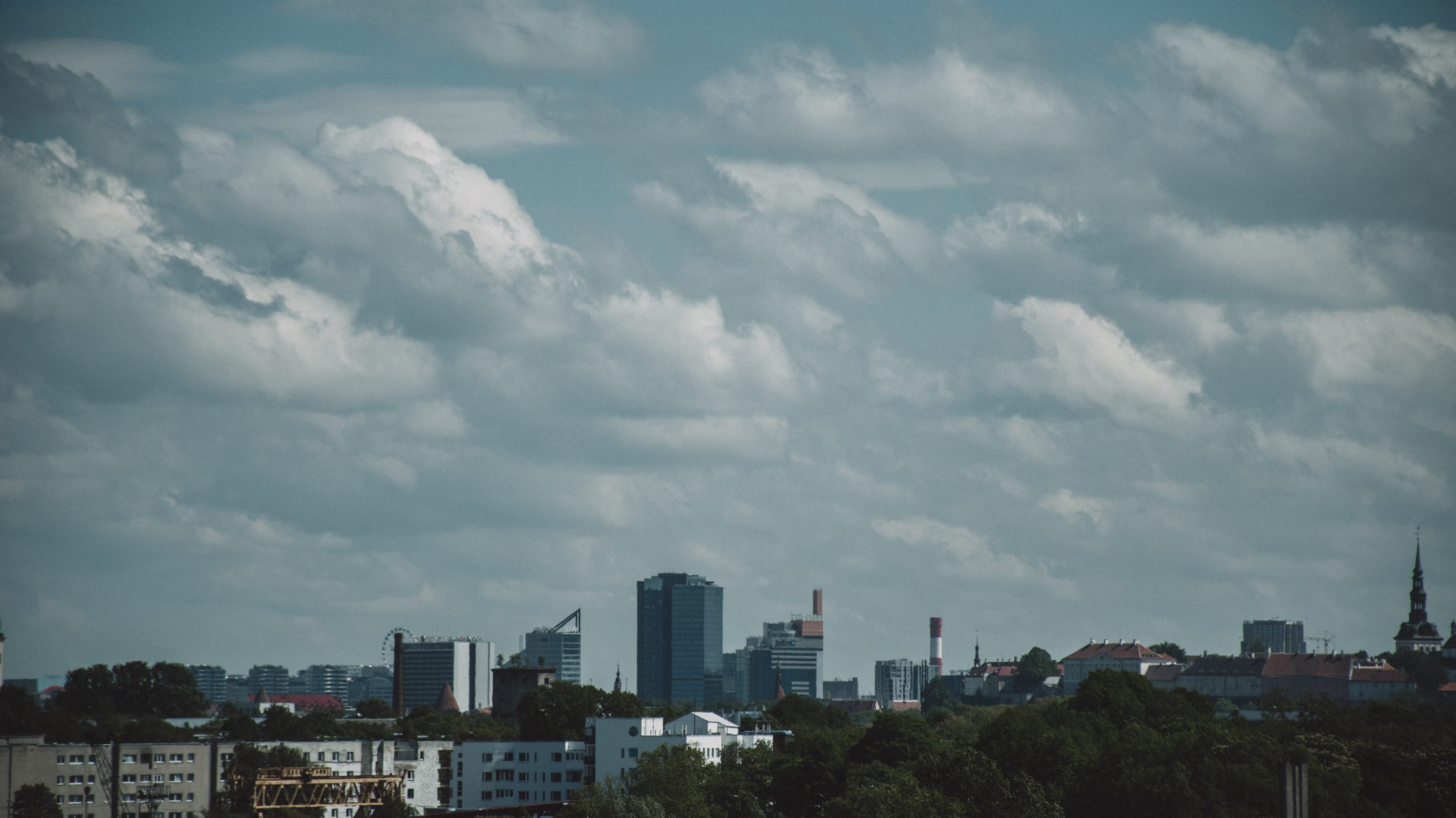 Tallinn skyline beneath layered summer clouds in Kopli, Tallinn, Estonia.