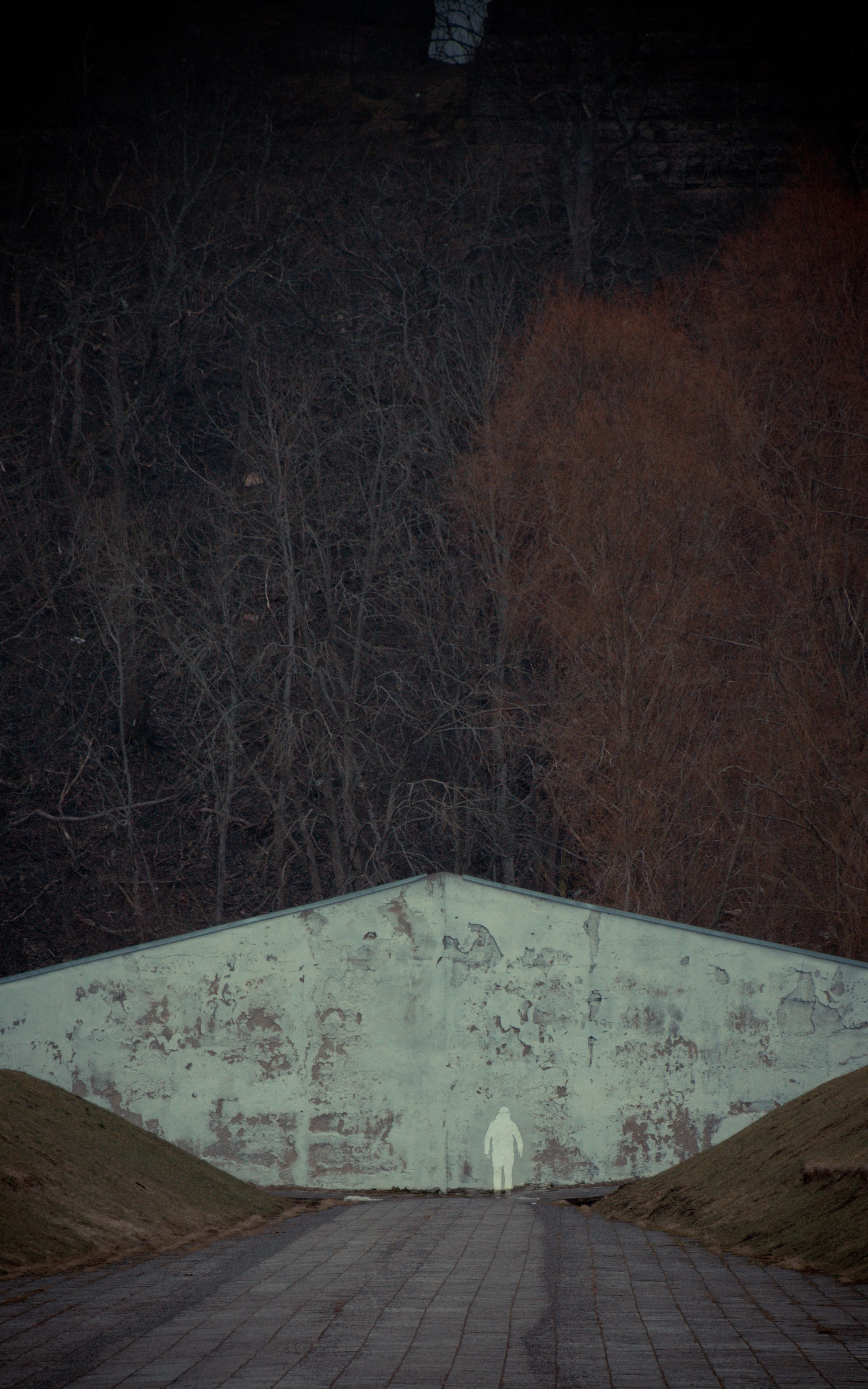 Angular stone memorial detail in deep shadow in Maarjamäe, Tallinn, Estonia.