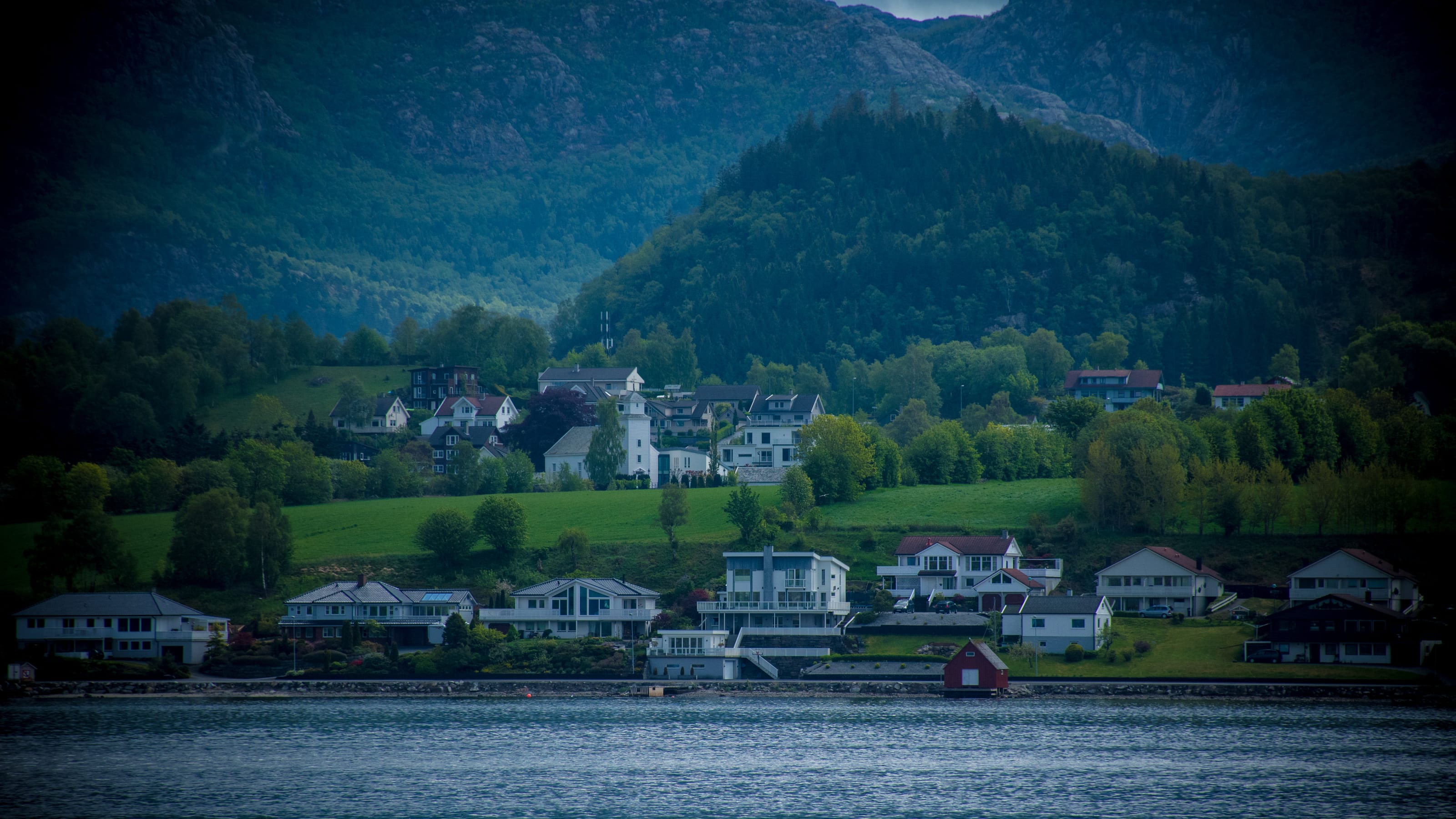 Suspension bridge spanning a narrow fjord in coastal Norway.